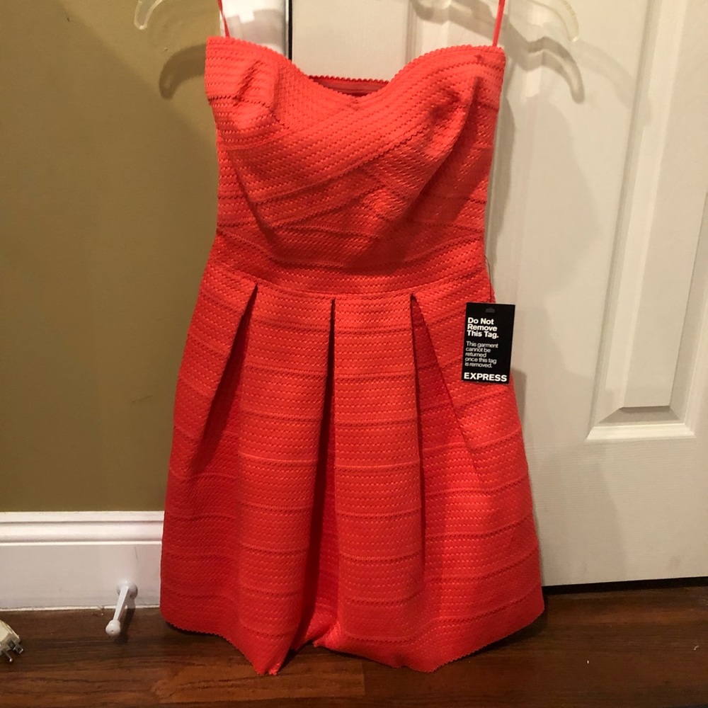 Bright orange Express strapless dress.